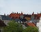 Tile roofs of Bergen, Norway and green street lamp