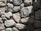 Tileable Stone wall texture seamless in half dark shadow