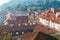 Tiled brown roofs of old houses in the autumn morning in Prague