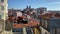 Tiled orange rooftops at an overlook miradouro in Porto, Portugal on a sunny day