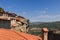 Tiled roofs, chimneys, and stairways of Great Meteoron Monastery from where panoramic view of entire Thessaly valley