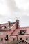 Tiled rooftops of pink European buildings