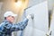 Tiler installing large format tile on wall. home indoors renovation