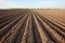 tilled, barren farming field ready for crop planting