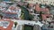 tilt aerial footage of Stearns Wharf Pier with blue ocean water, boats and yachts sailing and people relaxing in the sand