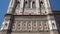 Tilt down of marble facade of Giotto bell tower, Cathedral of Saint Mary of the Flower, Florence, Italy