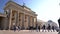 Tilt down people, tourists and students during the day by The Brandenburg Gate, Pariser Platz, Berlin, Germany