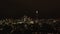Tilt down reveal of night city skyline. Modern high rise business buildings glowing into dark. London, UK