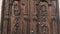 Tilt-down shot of an old wooden door in to a beautiful ancient place. Wood texture doors