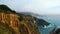 Tilt down on the Towering Cliffs of Big-Sur above the Pacific
