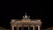 Tilt down video clip of people at night by The Brandenburg Gate, Pariser Platz, Berlin, Germany
