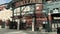 tilt footage of the ODoul Gate at Oracle Park with a man running, blue sky and clouds in San Francisco California