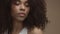 Tilt moving camera showing closeup portrait of mixed race black woman