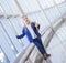 Tilt portrait of serious little blond girl in office building