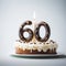 Tilt Shift 60th Birthday Cake With Candle On Gray Background