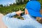 Tilt-shift defocused focus of senior male vineyard owner taking photos on