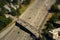 Tilt shift detail of bridge crossing interstate highway with cars