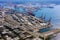 Tilt shift of shipping port with containers and loading transport ship with cargo