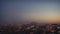 Tilt shift time lapse of sunset in big summer city