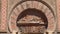 Tilt shot of door and facade of the Mosque of Cordoba, Andalucia, Spain.