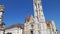Tilt shot down the main spire of Matthias Church, Fisherman`s Bastion, Budapest, Hungary on a bright sunny day