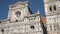 Tilt up of tourists in front of baptistery and Cathedral of Saint Mary of the Flower, Florence, Italy