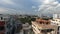 Tilt view of sunny clouds and city buildings