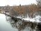 Tilted and fallen trees on the riverbank in winter, countryside