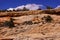 Tilted layers of sandstone cliffs