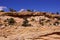 Tilted layers of sandstone cliffs