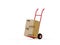 Tilted wheel barrow or hand truck with two cardboard boxes or parcels over white background, delivery or transportation concept