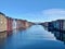 Timber buildings alongside calm water in city of Trondheim, Norway