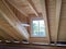 Timber frame construction of a roof truss with dormer window in the attic floor of a new residential building, construction work