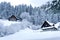 Timber Houses In Snowy Landscape