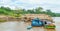 Timber loaded into big barge then drag by a tugboat cruising Mahakam River