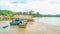 Timber loaded into big barge then drag by a tugboat cruising Mahakam River