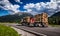 Timber truck rushes down the highway in the background the Alps.