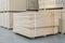 timber in warehouse. Pallet with boards in the hardware store. Packed boards in the building store. building materials. warehouse