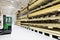 Timber warehouse - shelves with wooden planks and forklift