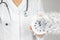 Time is crucial life saver. Concept healthcare. Doctor in white coat with stethoscope pointing and dissolving alarm clock. Time is