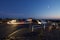 Time exposure gives glowing trail of headlights as car pulls into viewpoint on Mount Tolmie, Victoria, BC