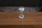 Time. Glass hourglass stands on the table