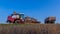 The time of harvest. Combine harvesters and other equipment early in the morning before starting work in the field.