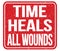 TIME HEALS ALL WOUNDS, words on red stamp sign