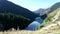 Time laps lake in the mountains. Transparent emerald green water like a mirror, reflects everything around it.