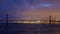 Time-lapse of 25 de Abril Bridge in the evening twilight. Lisbon, Portugal