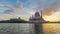 Time lapse 4k. Beautiful Sunrise At Putra Mosque, Putrajaya. Showing a moving and changing color clouds.