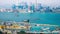 Time lapse aerial panorama view of Hong Kong Island with cargo port terminal