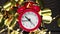 Time lapse of alarm clock running on golden confetti background. Nine o'clock on birthday of the beautiful alarm