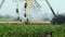 Time lapse of artificial pivot irrigating system circle move through the field